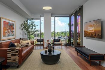 Floor-to-ceiling windows with high-performance glazing and acoustical glass for sound reduction